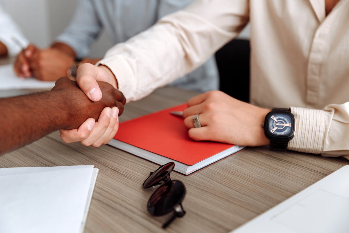 Close-up of a professional handshake — agent partnership
