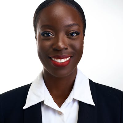 Professional corporate headshot of smiling woman